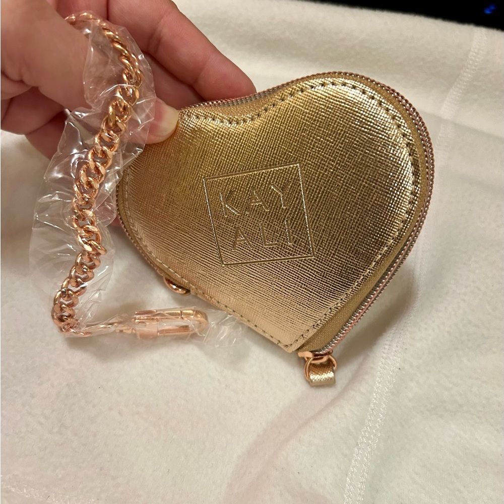 Kayaking by Huda Beauty heart shaped coin purse